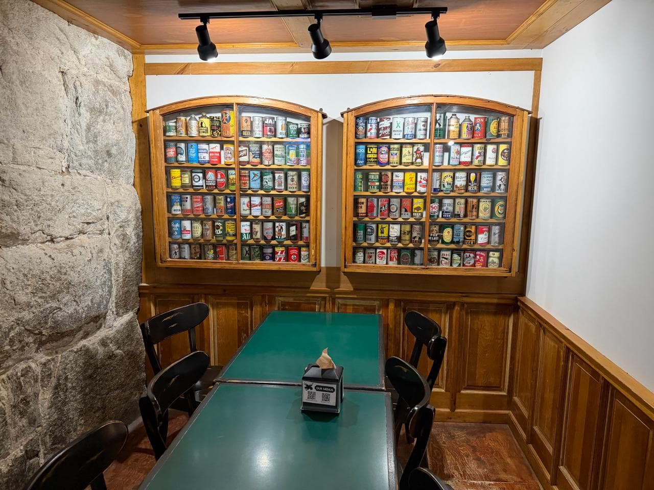 Beer can collection and pub decor at a White Mountains taproom