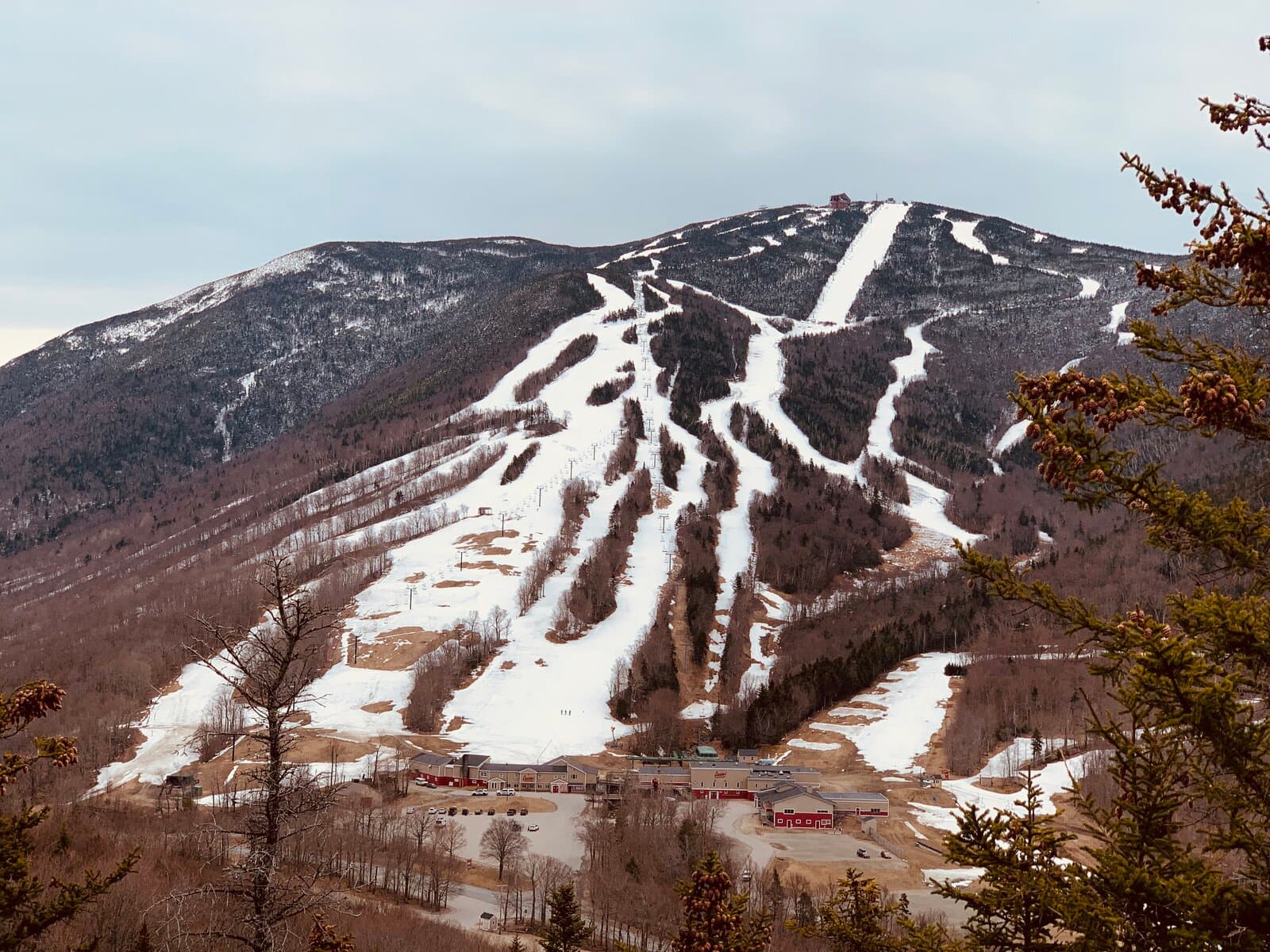 Ski mountain with trails and spring snow